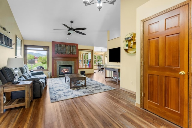 1815 Homestead Dr, Missoula, MT 59808 - living area featuring plenty of natural light, wood finished floors, a ceiling fan, a tile fireplace, and lofted ceiling