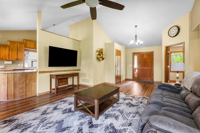 1815 Homestead Dr, Missoula, MT 59808 - living area with dark wood-style flooring, a chandelier, high vaulted ceiling, healthy amount of natural light, and ceiling fan