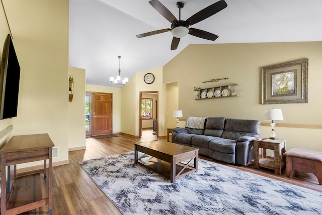 1815 Homestead Dr, Missoula, MT 59808 - living room with wood finished floors, ceiling fan, a chandelier, high vaulted ceiling, and baseboards