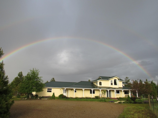 3688 Judith Ln, Darby, MT 59829 - view of front of home with covered porch, a standing seam roof, and metal roof