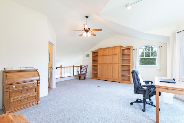 home office featuring light colored carpet, vaulted ceiling, and ceiling fan