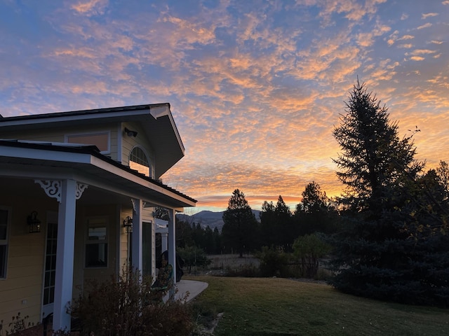 yard at dusk with a yard and a mountain view