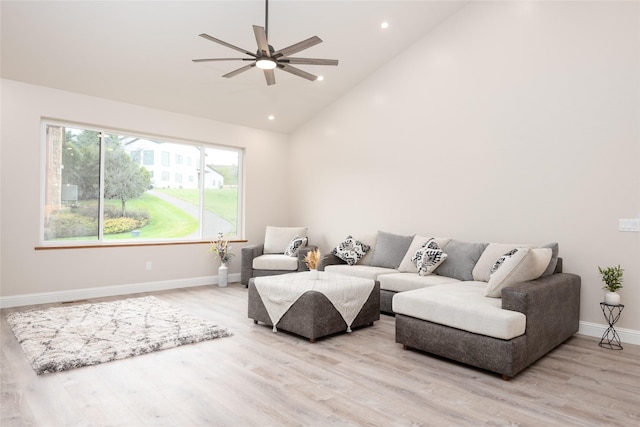 412 White Fox Run, Polson, MT 59860 - living area featuring light wood finished floors, ceiling fan, baseboards, recessed lighting, and high vaulted ceiling