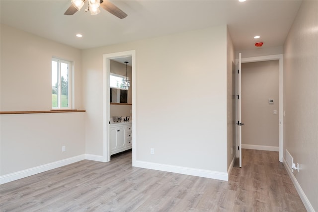 412 White Fox Run, Polson, MT 59860 - unfurnished bedroom featuring light wood-style floors, recessed lighting, baseboards, connected bathroom, and ceiling fan
