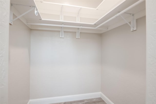 412 White Fox Run, Polson, MT 59860 - walk in closet featuring wood finished floors