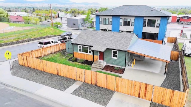 1240 Cannon St, Helena, MT 59601 - view of front of property with a shingled roof, a fenced backyard, and a residential view