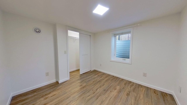 1240 Cannon St, Helena, MT 59601 - unfurnished bedroom with light wood finished floors, baseboards, and a closet