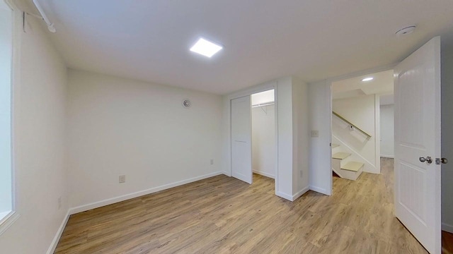 1240 Cannon St, Helena, MT 59601 - unfurnished bedroom with light wood-style flooring, baseboards, and a closet