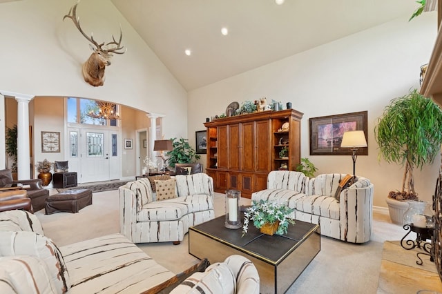 1225 Quail Ridge Dr, Kalispell, MT 59901 - living room with ornate columns, high vaulted ceiling, light colored carpet, a chandelier, and recessed lighting