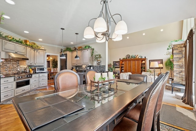 1225 Quail Ridge Dr, Kalispell, MT 59901 - dining area featuring a chandelier, recessed lighting, ornamental molding, and light wood finished floors