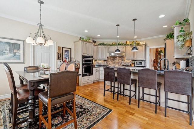 1225 Quail Ridge Dr, Kalispell, MT 59901 - dining space with light wood-style flooring, recessed lighting, ornamental molding, and a chandelier