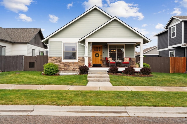 2442 Riata Rd, Missoula, MT 59808 - view of front facade featuring covered porch and stone siding