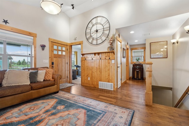 2442 Riata Rd, Missoula, MT 59808 - living area with wood-type flooring, healthy amount of natural light, and high vaulted ceiling