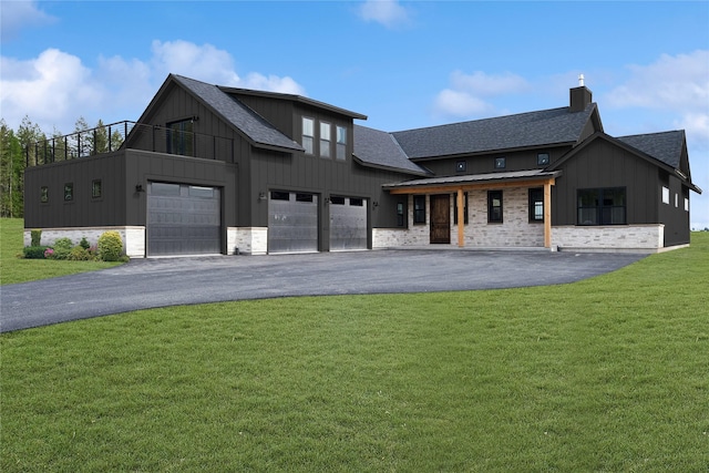 modern farmhouse style home with board and batten siding, roof with shingles, and a front yard