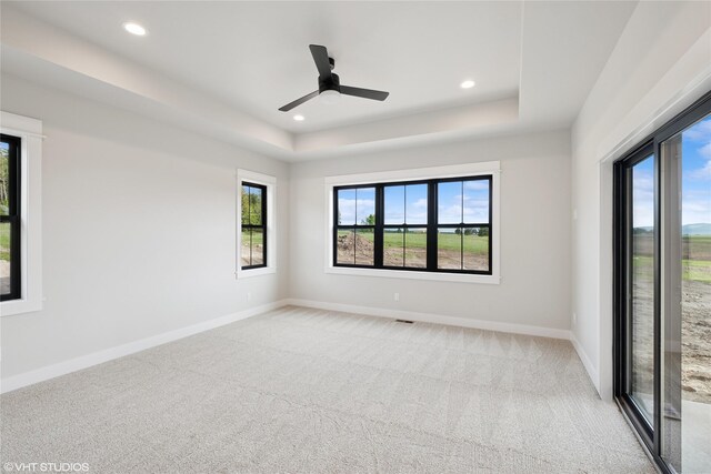 168 Wood Ridge Dr, Columbia Falls, MT 59912 - spare room with carpet flooring, a raised ceiling, recessed lighting, and a ceiling fan