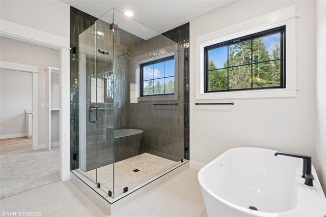 168 Wood Ridge Dr, Columbia Falls, MT 59912 - bathroom featuring a freestanding tub and a shower stall
