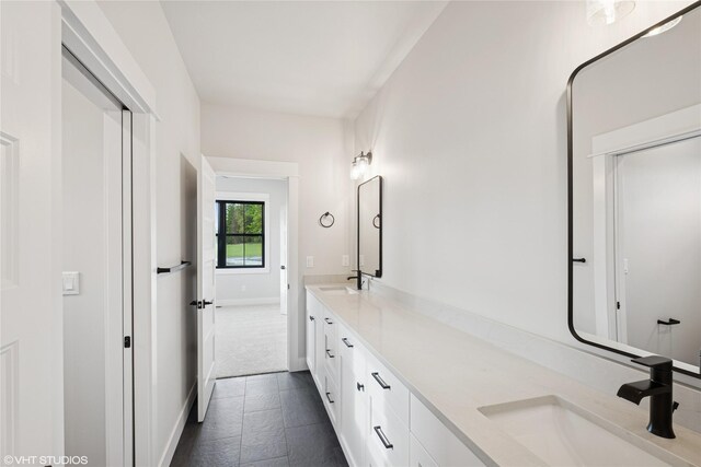168 Wood Ridge Dr, Columbia Falls, MT 59912 - full bathroom with double vanity and baseboards