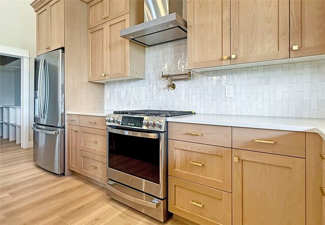 168 Wood Ridge Dr, Columbia Falls, MT 59912 - kitchen featuring appliances with stainless steel finishes, wall chimney exhaust hood, high vaulted ceiling, light countertops, and decorative backsplash