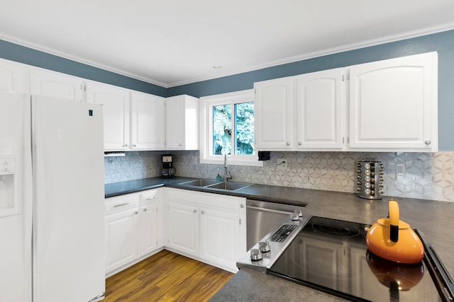 4003 Thomas Pl, Missoula, MT 59803 - kitchen with white fridge with ice dispenser, dark countertops, a sink, white cabinets, and tasteful backsplash
