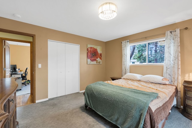 4003 Thomas Pl, Missoula, MT 59803 - bedroom with carpet flooring, an office area, a closet, baseboards, and a chandelier