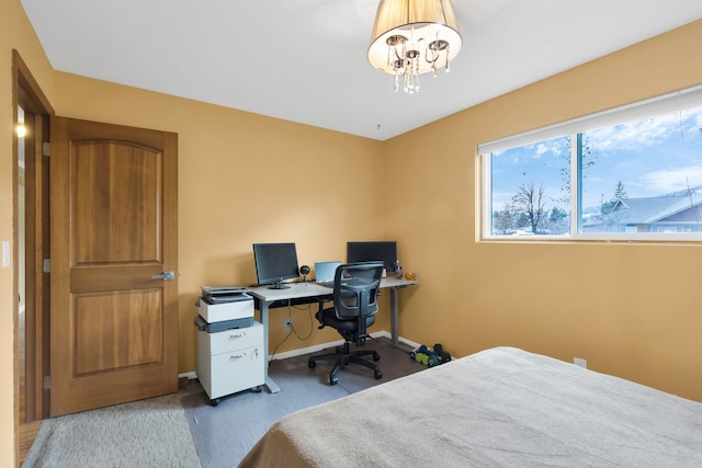 4003 Thomas Pl, Missoula, MT 59803 - carpeted bedroom with a chandelier, baseboards, and a desk