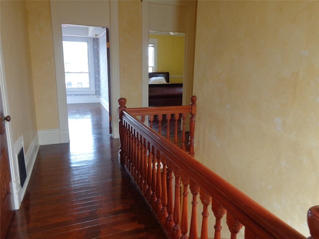523 Hickory St, Anaconda, MT 59711 - hall featuring an upstairs landing, dark wood-type flooring, and baseboards