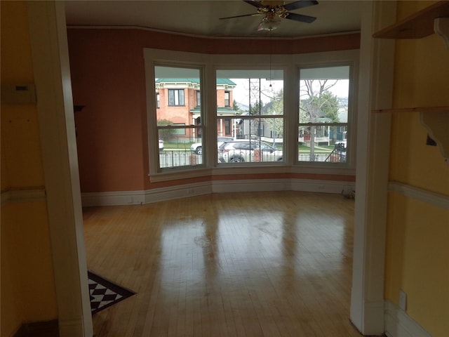 523 Hickory St, Anaconda, MT 59711 - empty room with a ceiling fan, wood finished floors, baseboards, and ornamental molding