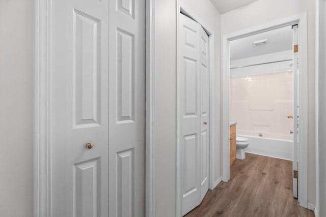hall with wood finished floors