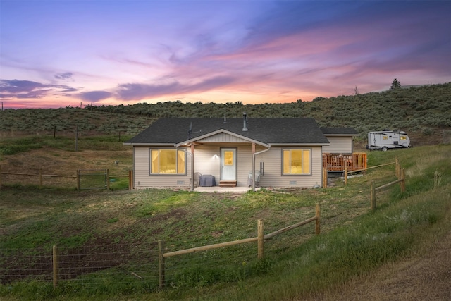 688 Black Horse Trl, Stevensville, MT 59870 - bungalow-style home with a fenced backyard and a patio