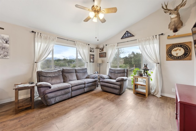 688 Black Horse Trl, Stevensville, MT 59870 - living area featuring ceiling fan, lofted ceiling, light wood-style flooring, and baseboards