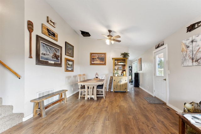 688 Black Horse Trl, Stevensville, MT 59870 - foyer featuring wood finished floors, stairway, a ceiling fan, baseboards, and vaulted ceiling