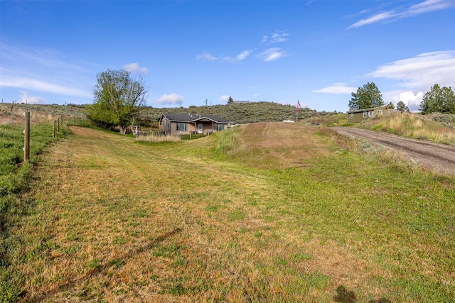 688 Black Horse Trl, Stevensville, MT 59870 - view of grassy yard featuring a rural view