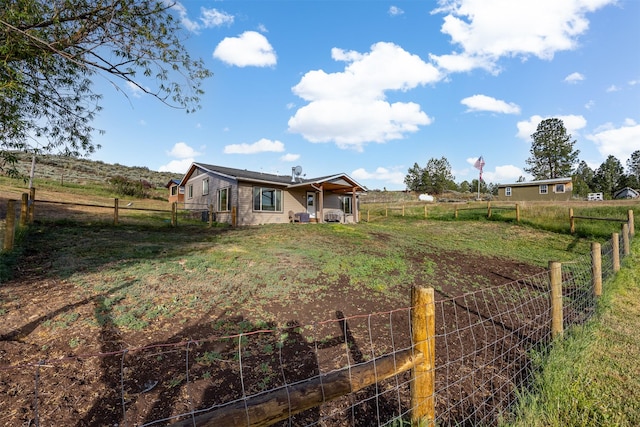 688 Black Horse Trl, Stevensville, MT 59870 - fenced backyard featuring a rural view and a garden