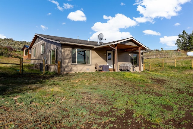 688 Black Horse Trl, Stevensville, MT 59870 - back of house featuring a gate