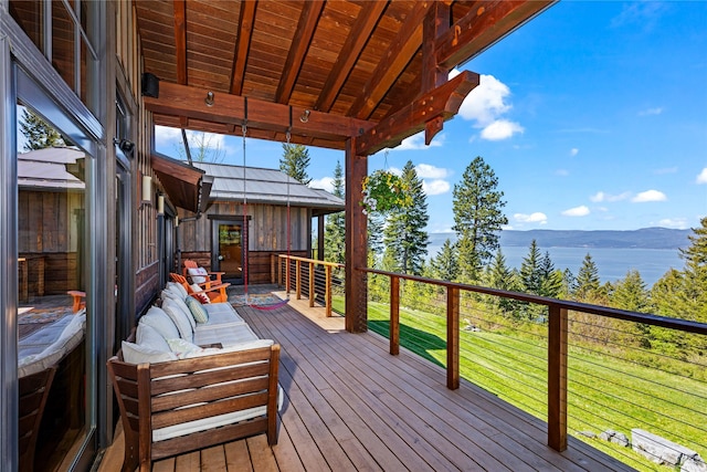 32220 Tamarack Dr, Bigfork, MT 59911 - deck featuring a water view and a yard