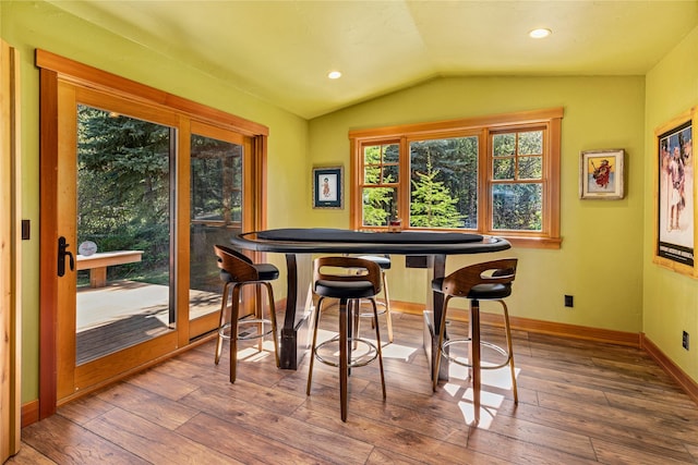 32220 Tamarack Dr, Bigfork, MT 59911 - dining area featuring vaulted ceiling, hardwood / wood-style flooring, and recessed lighting
