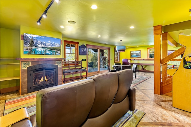 32220 Tamarack Dr, Bigfork, MT 59911 - living area with a fireplace, track lighting, and recessed lighting