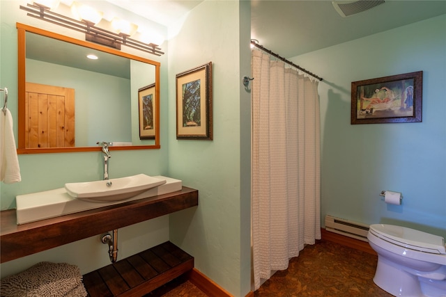 32220 Tamarack Dr, Bigfork, MT 59911 - bathroom with a baseboard heating unit and curtained shower