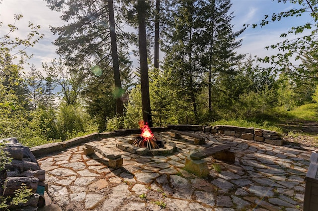 32220 Tamarack Dr, Bigfork, MT 59911 - view of patio with a fire pit