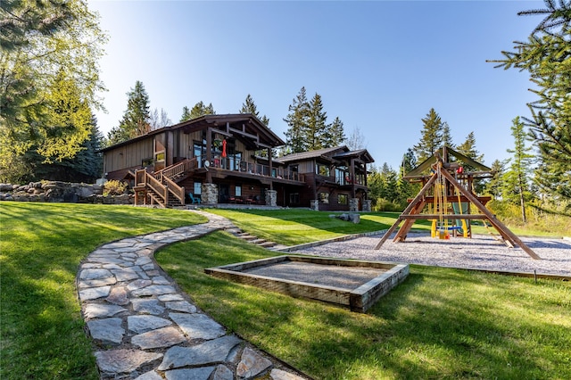 32220 Tamarack Dr, Bigfork, MT 59911 - view of play area with a yard and stairway