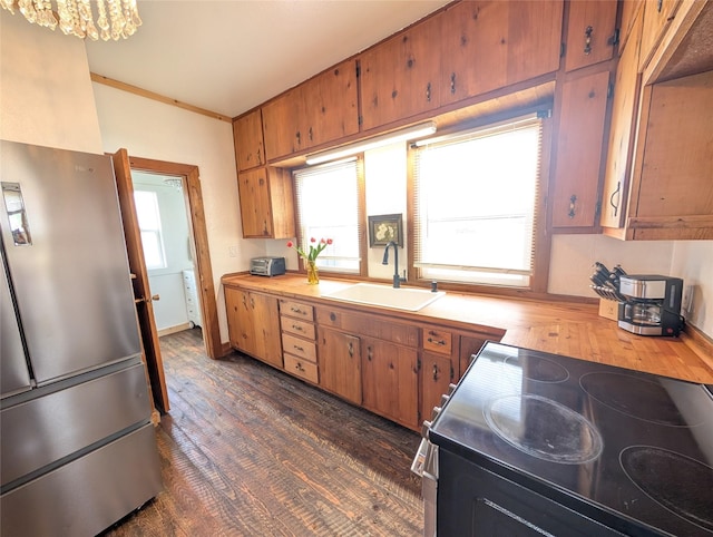403 Mission St, Stevensville, MT 59870 - kitchen featuring a sink, freestanding refrigerator, range with electric stovetop, dark wood-style floors, and wooden counters