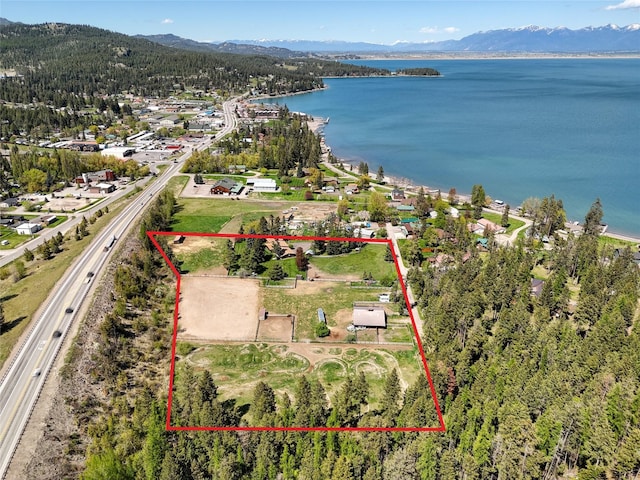 38 Lakeside Ave, Lakeside, MT 59922 - view of property location with property parcel outlined, a water and mountain view, and a major roadway
