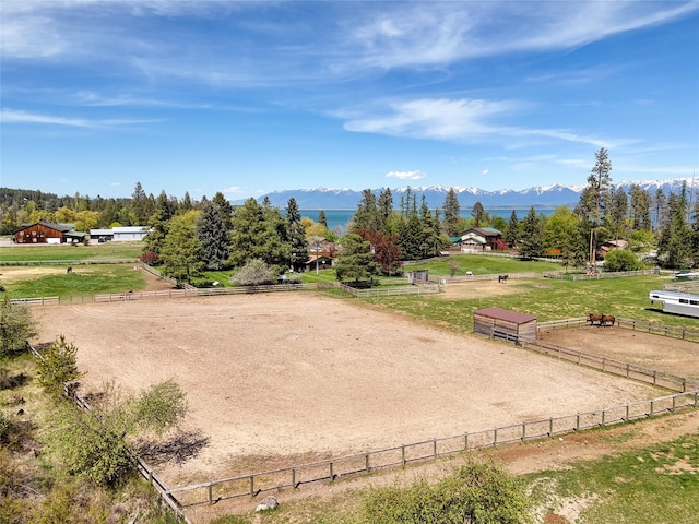 38 Lakeside Ave, Lakeside, MT 59922 - view of property's community featuring an outdoor riding arena, a view of rural / pastoral area, a mountain view, and fence