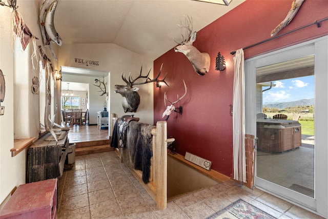 405 Lower Deep Creek Rd, Townsend, MT 59644 - hall with vaulted ceiling, a mountain view, and tile patterned floors
