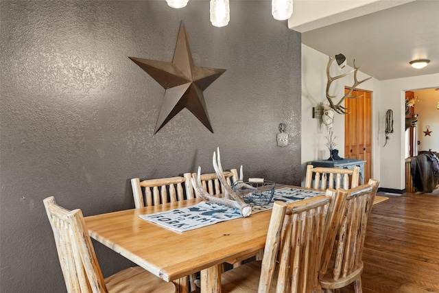405 Lower Deep Creek Rd, Townsend, MT 59644 - dining room featuring wood finished floors and a textured wall