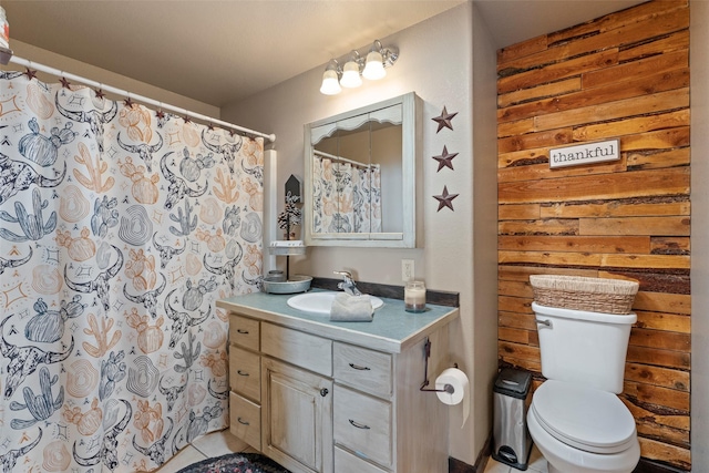 405 Lower Deep Creek Rd, Townsend, MT 59644 - full bathroom featuring vanity, wooden walls, and curtained shower