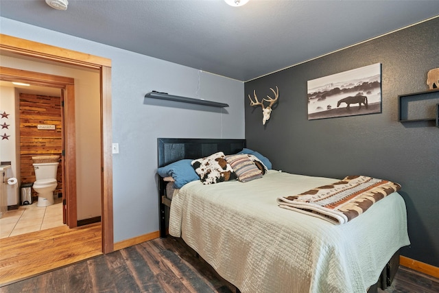 405 Lower Deep Creek Rd, Townsend, MT 59644 - bedroom featuring wood finished floors and ensuite bathroom
