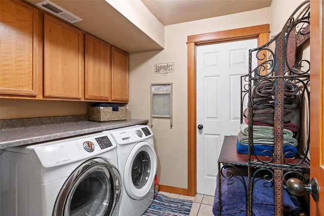 405 Lower Deep Creek Rd, Townsend, MT 59644 - laundry area featuring cabinet space, separate washer and dryer, and light tile patterned floors