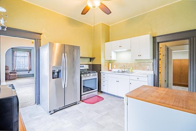 601 S Idaho St, Butte, MT 59701 - kitchen with appliances with stainless steel finishes, a ceiling fan, white cabinetry, and a sink