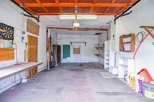601 S Idaho St, Butte, MT 59701 - garage with a workshop area and a garage door opener
